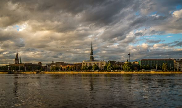 Panorama of Old Riga city at sunset. View from the Daugava river