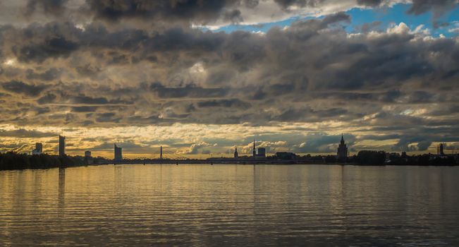 Panorama of Old Riga city at sunset. View from the Daugava river