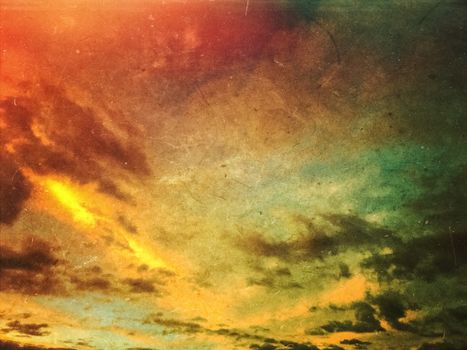 Apocalyptic grunge sunset sky and clouds background. Dusty scratched texture.