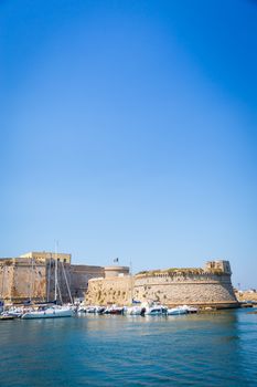 The harbour and the old walls of Gallipoli, Puglia Region - South Italy