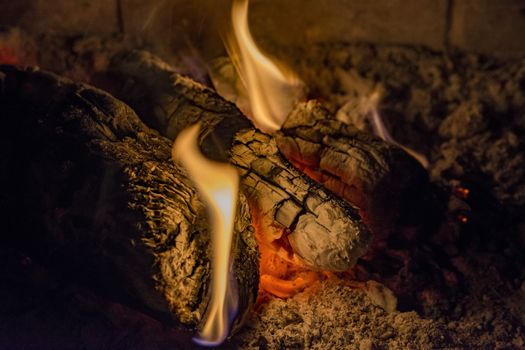 woods are burning inside a fireplace