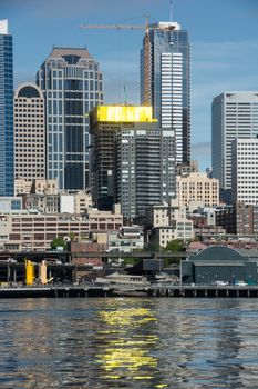 New construction yields golden reflections on the still waters of Seattle's Elliott Bay