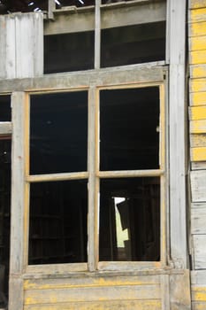 Window frames on entry door to weathered, collapsing Barn in the Palouse region of Eastern Washington