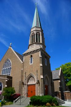 Gothic Church in Bellingham, WA with blue sky and wispy clouds