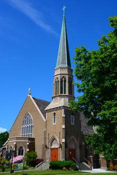 Gothic Church in Bellingham, WA with blue sky and wispy clouds