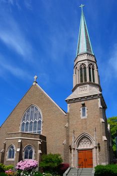 Gothic Church in Bellingham, WA with blue sky and wispy clouds