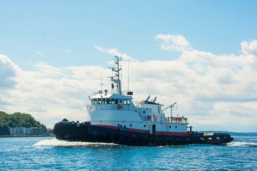 Tug returning from trip north.  with a "bone in her teeth"