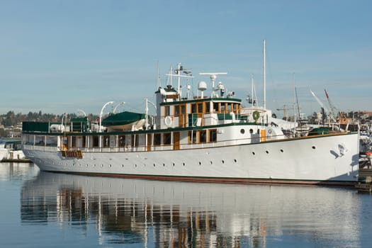 Fantail Yacht at the Dock in Seattle's Lake Union on a calm day with full reflection