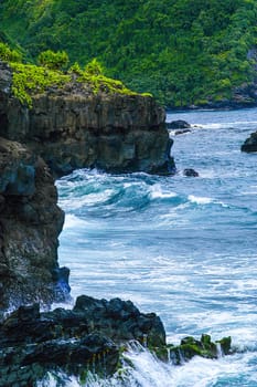Waves breaking on rocks on Maui Coast