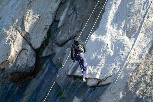 Rock Climbers scale rocks at Lake Perris, CA