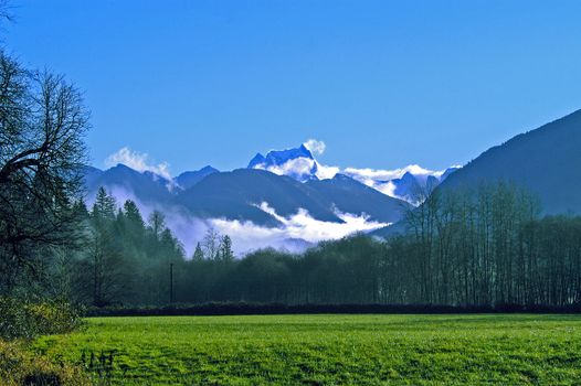 Snow-capped North Cascades from Skagit Valley, WA