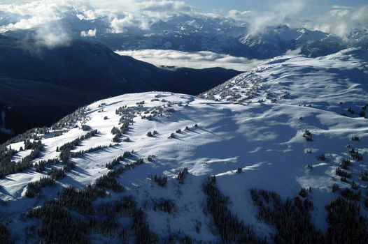 Aerial scene taken from plane flying over mountans of Whistler. BC