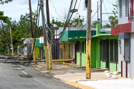 Roadside scene in Rincon, Puerto Rico after Hurricane Marie showing damage to businesses and power lines