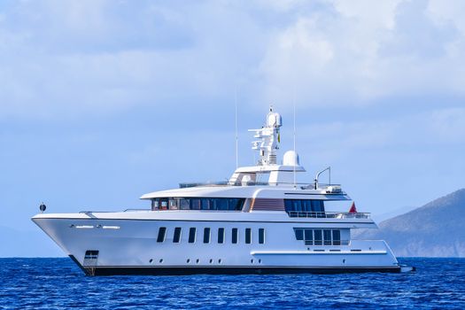 Large power yacht with anchor out in the British Virgin Islands