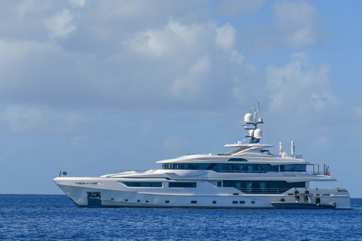 Megayach with tender alongside in British Virgin Islands