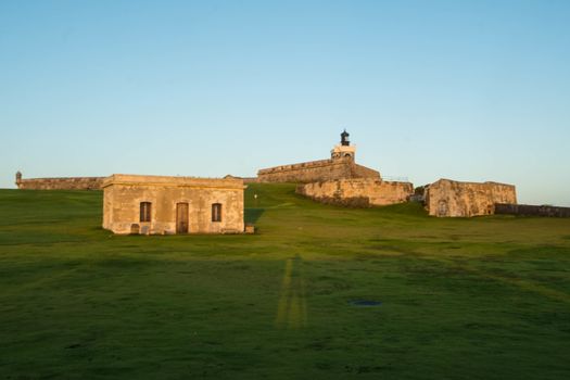 Sunrise view of Castillo Del Morello with lighthouse.