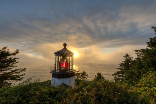 Iconic lighthouse on Cape Meares on Oregon's Pacific Coast at sunset