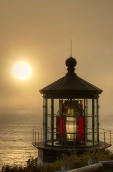 Iconic lighthouse on Cape Meares on Oregon's Pacific Coast at sunset