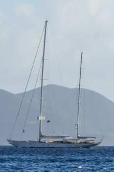 Mega sailing ketch anchored offshore in British Virgin Islands.