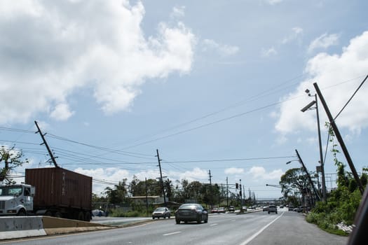 Damage to trees, powerlines, and building in Puerto Rico from Hurricane Maria, Sep 2017