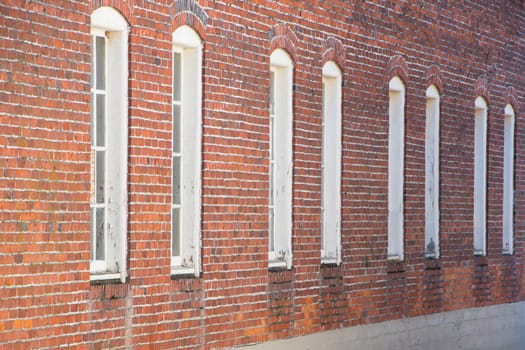 Windows in red brick building in small town, Washington State