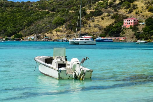 View of Caribbean beach in Virgin Islands showing boats at anchor