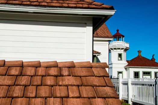 Angles and textures in Lighthouse roof viewed from below lowest roof with clear blue sky