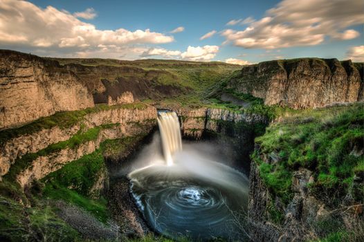 Time lapse of Palouse Falls, WA, showing swirling pattern of water below falls.