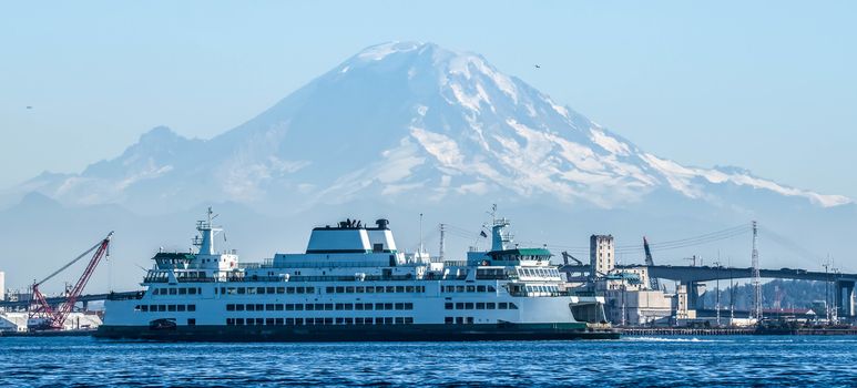 Washingon State ferry on Elliott Bay with Mount Rainier in the background.