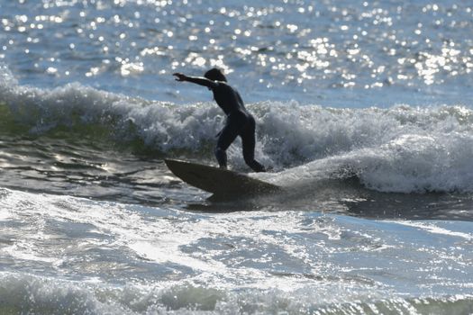 Surfers enjoying good waves at La Push, Washington's First Beach.