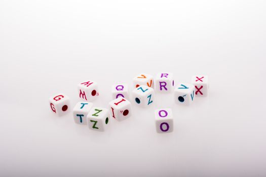 Colorful alphabet letter cubes on a white background