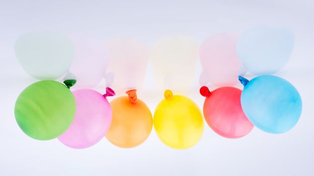 Colorful small baloons on a white background