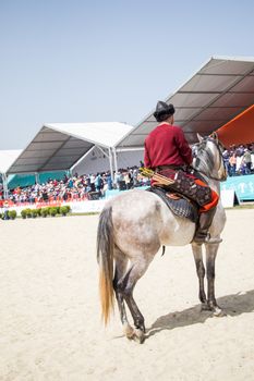 Ottoman horseman in his ethnic clothes riding on his horse