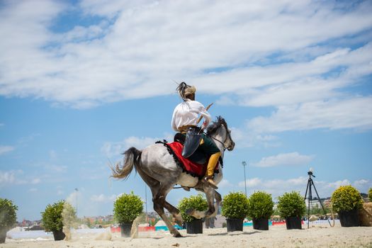 Ottoman horseman in his ethnic clothes riding on his horse