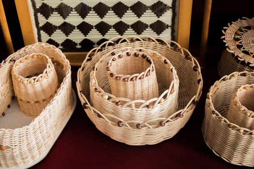 Empty wicker baskets are for sale in a market