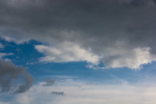 Dark and grey clouds are in the sky