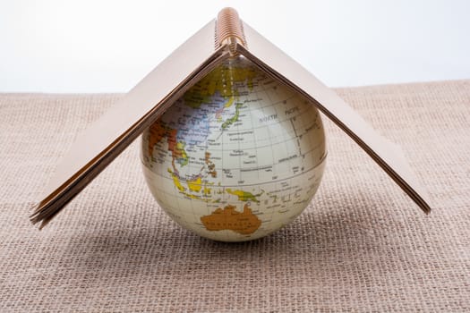 Globe is placed on canvas background