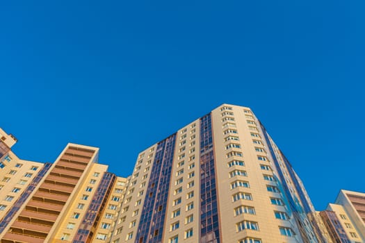 Modern building exterior low angle view with blue sky