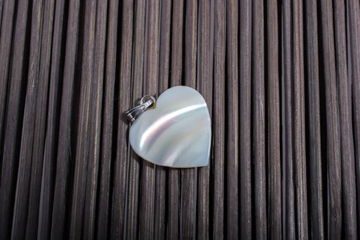 Heart shaped icon placed on a straw mat