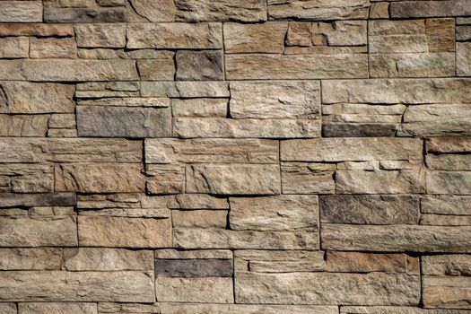 Wall made of the same type and same color of stones