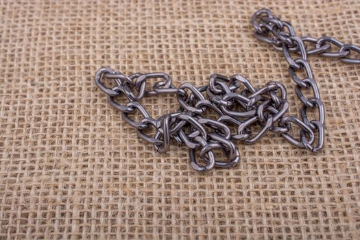chain on a linen canvas as a background texture