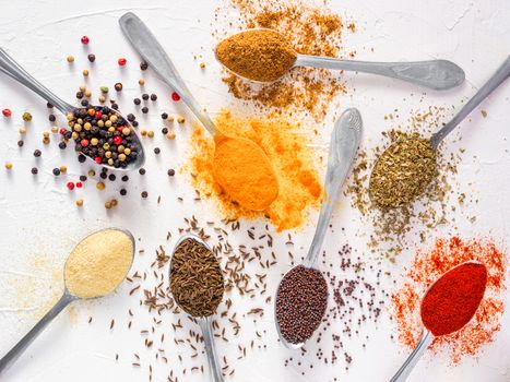 Top view mix indian spices and herbs difference on white background. Food background for design vegetable, healthy lifestyle, spices, herbs or foods content