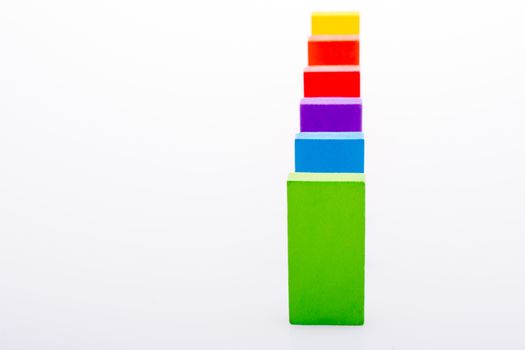 Colorful Domino Blocks in a line on a white background