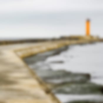 Yellow lighthouse - soft lens bokeh image. Defocused background