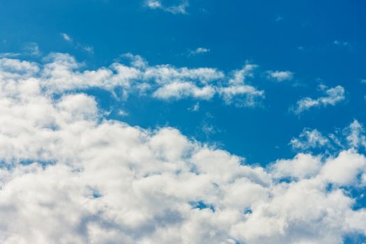 Deep blue bright sky with clouds 