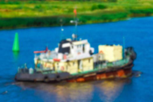 Tug ship - soft lens bokeh image. Defocused background
