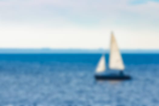 Yacht in the sea - soft lens bokeh image. Defocused background