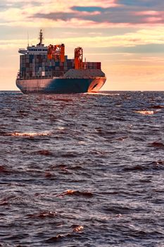 Blue container ship. World logistics and production transfer