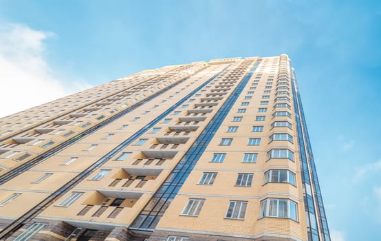 Modern building exterior low angle view with blue sky