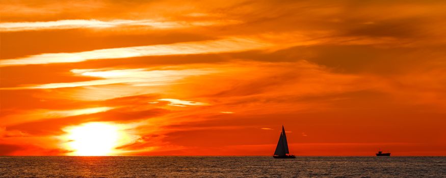 Hot and romantic sunset over the Baltic sea. Calm landscape